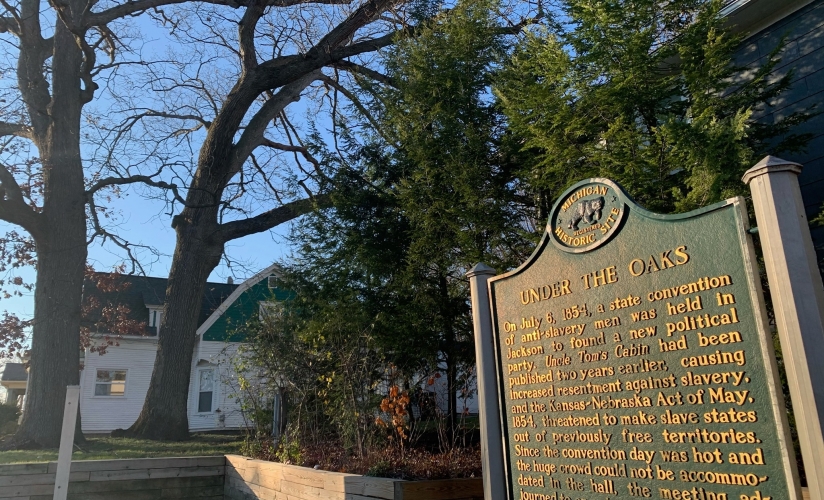 Under the Oaks sign